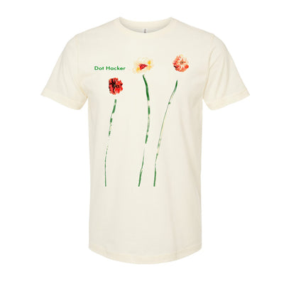 image of an natural colored tee shirt on a white background. tee has full body print of three abstract flowers