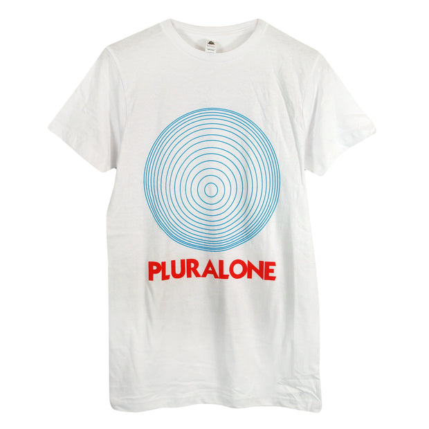 image of a white tee shirt on a white background. tee has full body print of blue circles and below that in red says pluralone