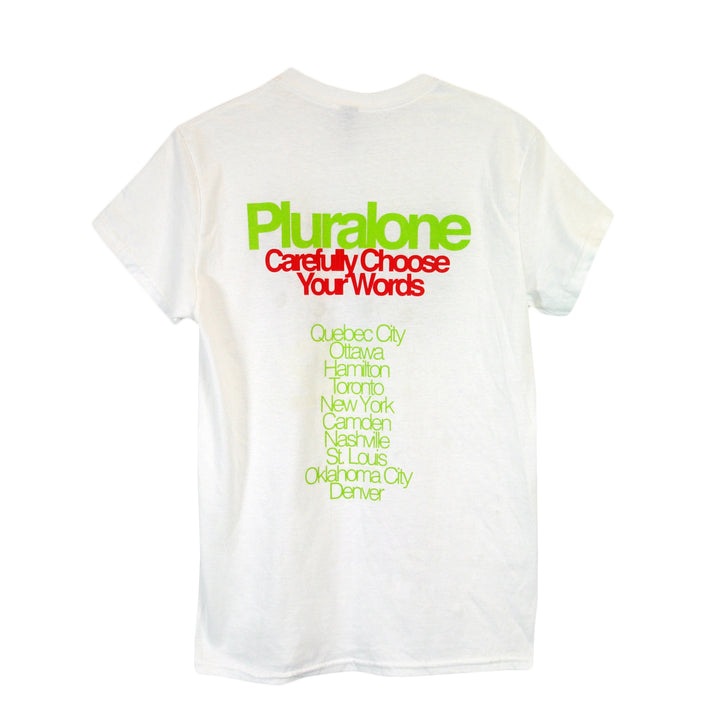 image of the back of a white tee shirt on a white background. the tee  has a full back print. at the top in lime green says pluralone. below in red says carefully choose your words and then the tour locations of the second leg below.