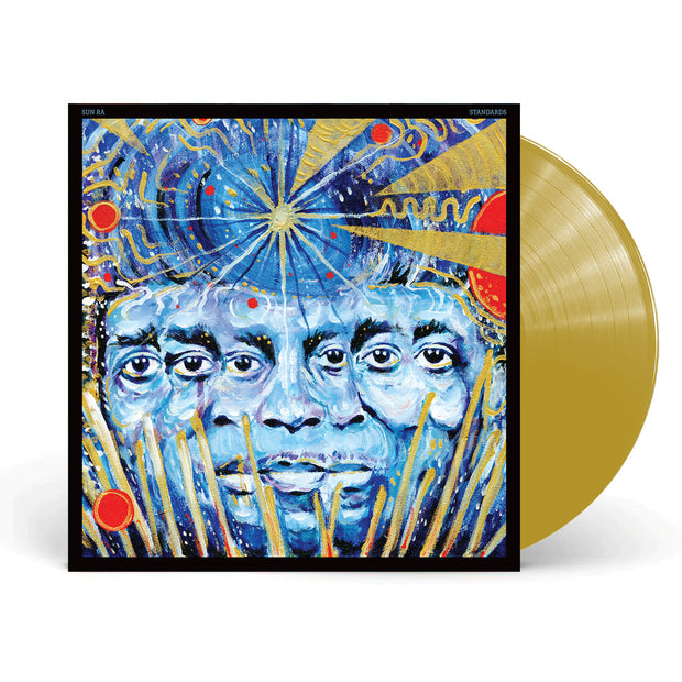 Sun Ra Standards Gold Vinyl LP. Image has vinyl exposed to show the Gold Color. Album art is a artistic multi-faced being in a painted galaxy like background. 