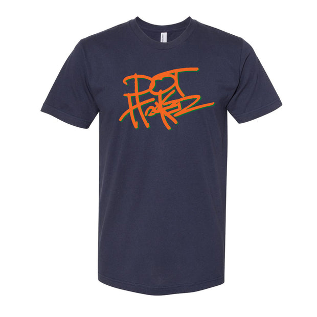 image of a navy tee shirt on a white background. tee has center print in orange that says dot hacker